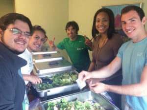 Students prepare to serve food to the homeless in downtown Austin