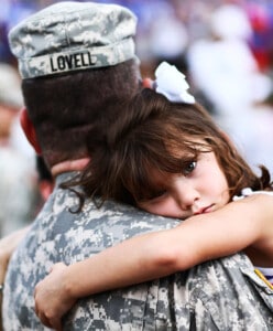 "Welcome home," by the U.S. Army via Creative Commons. Five-year-old Maddie Lovell, right, clings to her father, U.S. Army Sgt. 1st Class Jacob Lovell, of 585th Military Police Company, during a welcome home ceremony, at Marysville High School, in Marysville, Ohio, Aug. 13, 2010. Lovell and about 170 other Soldiers, of 585th Military Police Company returned home, from the unit's first deployment, in support of Operation Iraqi Freedom, after training over 500 Iraqi Police officers, conducting anti-terrorism and force protection missions, and providing Provost Marshall law enforcement, in Iraq's Anbar Province. (U.S. Army photo by Sgt. Sean Mathis/Released)